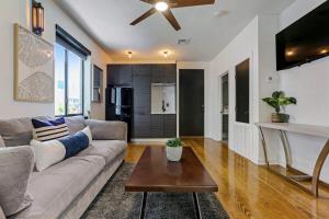 a living room with a couch and a table at Ivory 2 Bedroom Villa in New Orleans