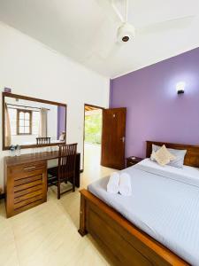 Postel nebo postele na pokoji v ubytování Ravan Resort Tangalle