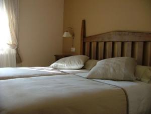 Ένα ή περισσότερα κρεβάτια σε δωμάτιο στο Hotel Areulo