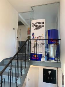 a staircase with a glass shelf with a sign on it at Privatunterkunft für Motorsportbegeisterte Nähe Red Bull Ring in Fisching
