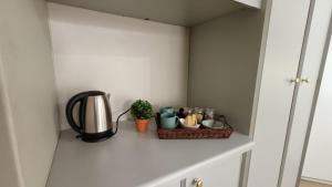 a kitchen counter with a coffee maker and a basket at 741 Tetra Self Catering Accommodation in Pretoria