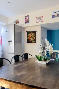 a dining room with a table and a stained glass window at BIG House close to Metro Underground - Sleeps up to 13 in London