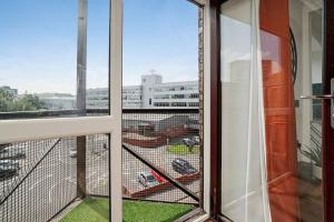 a balcony with a view of a parking lot at New Slick Finnieston Pad w/ Free Parking in Glasgow