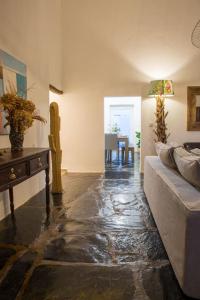 a living room with a couch and a table at Monte da Falagueira by Portus Alacer in Arronches