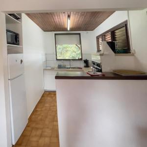 a kitchen with a sink and a counter top at Villa Vivi in Gros-Morne +11 photos