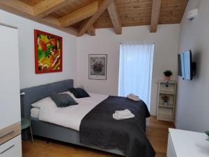 a bedroom with a large bed in a room at Boutique Apartments Cecilia in Trieste
