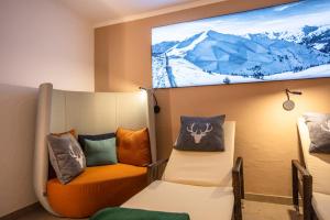 Televisyen dan/atau pusat hiburan di Hotel Oberwirt - nahe an Saalbach und Zell am See, Viehhofen Sommercard