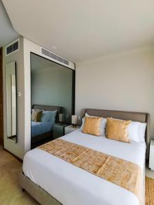 Letto o letti in una camera di Alizee Tower