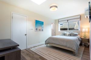 a bedroom with a large bed and a window at Downtown Mill Valley Modern Cozy Upstairs Apartment in Best San Francisco Bay Area in Mill Valley