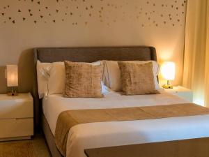 Letto o letti in una camera di Alizee Tower