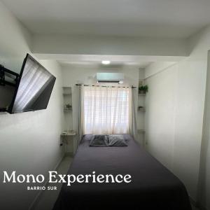מיטה או מיטות בחדר ב-Mono Experience in SMDT- near CASA HISTORICA