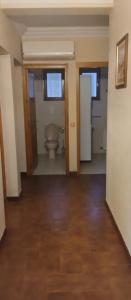 a bathroom with a toilet in a room at Maison en pierre de taille in Petreto-Bicchisano