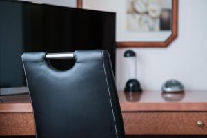 Sjónvarps- og/eða afþreyingartæki á Hotel Flora Möhringen
