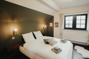 Llit o llits en una habitació de L'Ecluse Simon