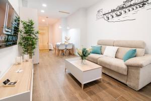 a living room with a couch and a table at Loft Premium Córdoba in Córdoba