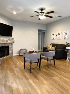 a living room with a couch and a fireplace at Modern 2 bedroom house w/backyard @La Cantera in San Antonio