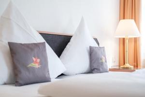 Rúm í herbergi á Hotel Flora Möhringen