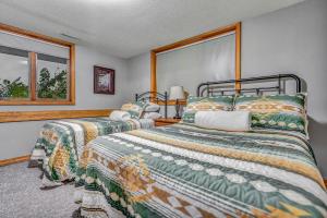 a bedroom with two beds and a window at Majestic View Sleeps 10 Hot Tub in De Soto