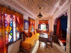 a living room with a couch and a table at Blue city Chefchaouen in Chefchaouene