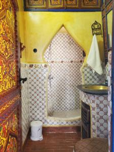 a small bathroom with a shower in a room at Blue city Chefchaouen in Chefchaouen