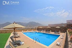 a pool at a resort with mountains in the background at Casa Dama in Cieneguilla