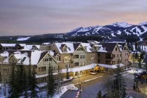 an aerial view of a resort with snow covered mountains at Hyatt Main Street Station Studio in Breckenridge