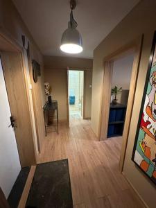 a hallway of a home with a room with a table and a hallwayngthngth at Business and getaway in Jelgava