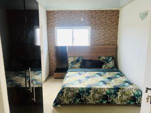 Un pat sau paturi într-o cameră la Cocooning vue sur mer