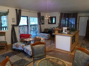 a living room with a couch and a table at Aloha Crater Lodge in Volcano