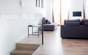 a living room with a couch and a table at Apartment Santa Cruz Suite TI105 in Palma de Mallorca