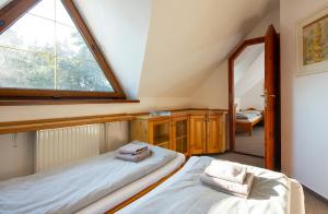 A bed or beds in a room at Wellness Vila Astra