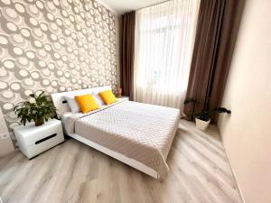 Posteľ alebo postele v izbe v ubytovaní OSapart Beautiful apartment in a complex Semycvit