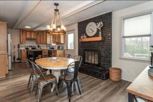 a kitchen and dining room with a table and chairs at Pet Friendly House with Bike Trail Access and Huge Fenced Yard in Greenville