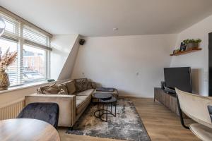 Luxe appartement in centrum van Groningen! tesisinde bir oturma alanı