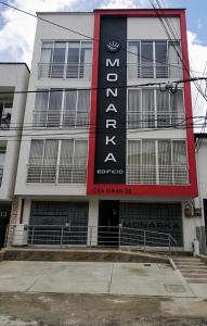 a building with a sign on the side of it at Hotel Monarka-Edificio in Popayan