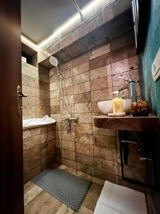 a bathroom with a sink and a shower at Blaje in Breaza de Jos
