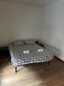 a bed in a room with at Reve Divin T2 en R/C parking-bagagerie-salle sport-barbecue in Lourdes