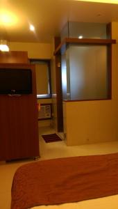 Postel nebo postele na pokoji v ubytování Hotel Sai Sanidhya