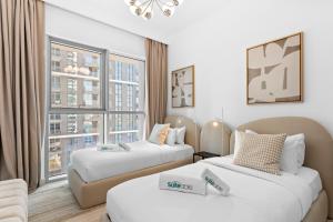 Voodi või voodid majutusasutuse Your beachfront luxe escape experience - Suiteable toas