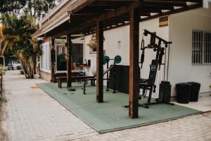 a building with a fitness center with a gym at Pousada Recanto das Cerejeiras in Rio Grande +35 photos