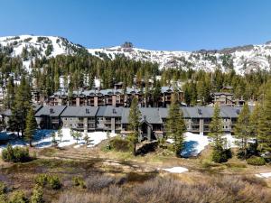 an aerial view of a resort with snow covered mountains at Kirkwood Mountain Resort Properties in Kirkwood