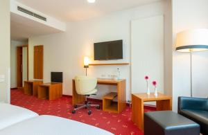 Et tv og/eller underholdning på Leonardo Hotel Berlin KU'DAMM + 17 billeder