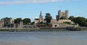 a view of a castle from the water at Dove's Place in historic Rochester with Parking in Strood