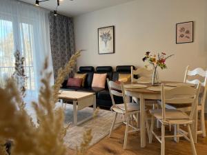 Posezení v ubytování Apartament NOWE POJEZIERZE