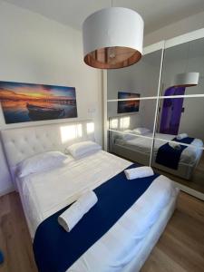 Postel nebo postele na pokoji v ubytování Island Suites Waterfront IUN R5783