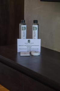 two bottles of water sitting on top of a table at Hotel Expo Alcalá, a 1 min de Plaza del Sol in Guadalajara