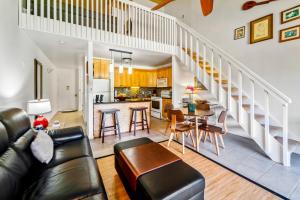 a living room with a couch and a table at Turtle Bay Townhouse Steps to Our Beautiful Beach! in Kahuku