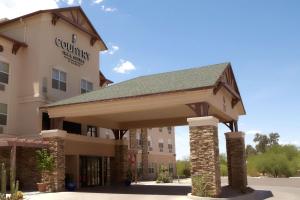 una representación de un hotel con un edificio en Country Inn & Suites by Radisson, Tucson City Center AZ, en Tucson