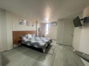 Postel nebo postele na pokoji v ubytování Apartamentos AEROPUERTO