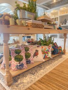 a row of pillows on a shelf in a store at The Lighthouse Boutique Hotel in Port Isabel